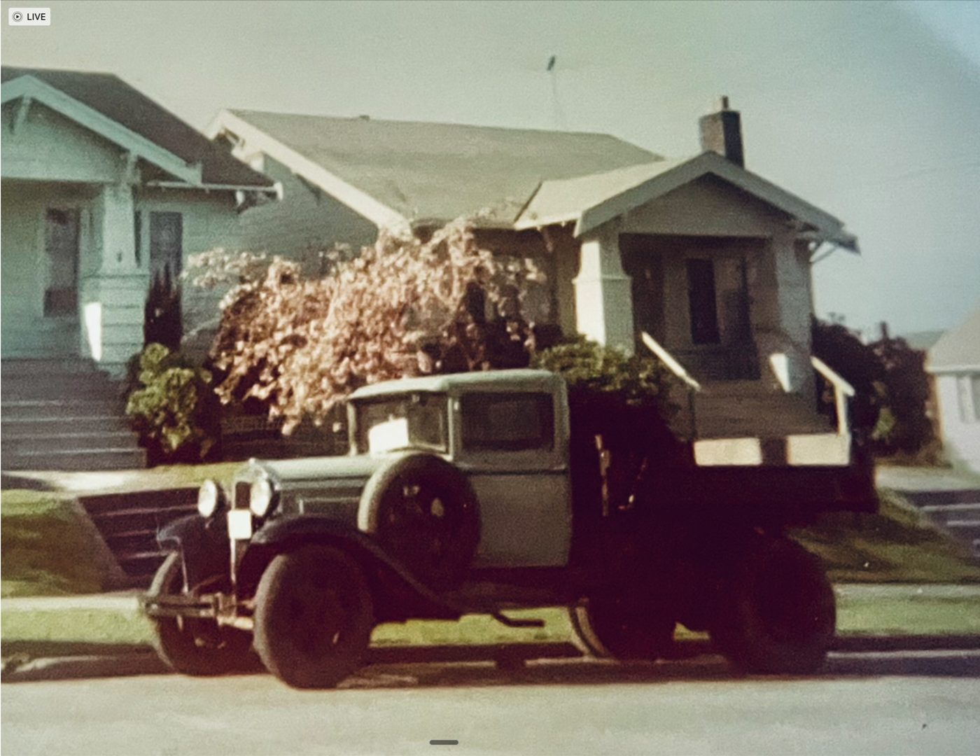 Donald Clausen’s 1930 Ford flatbed truck, ‘Herkimer,’ parked on a street — a family photograph.